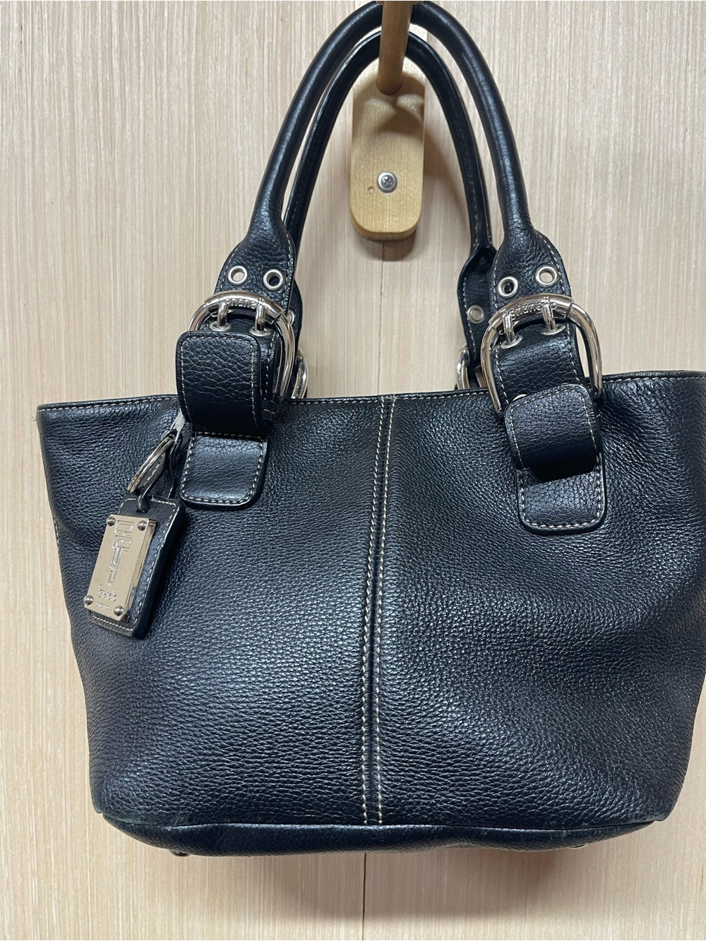 Vintage Tignanello black leather bag with buckle handles, size medium,